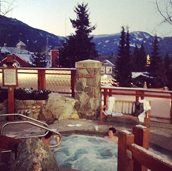 The romantic hot tub surrounded by mountains at the Pan Pacific Whistler Village.
